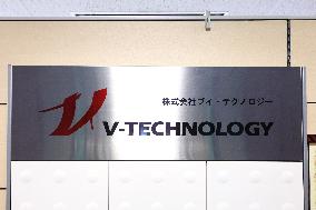 V Technology signboard and logo